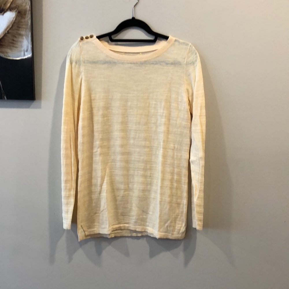 Pale yellow long sleeve top.